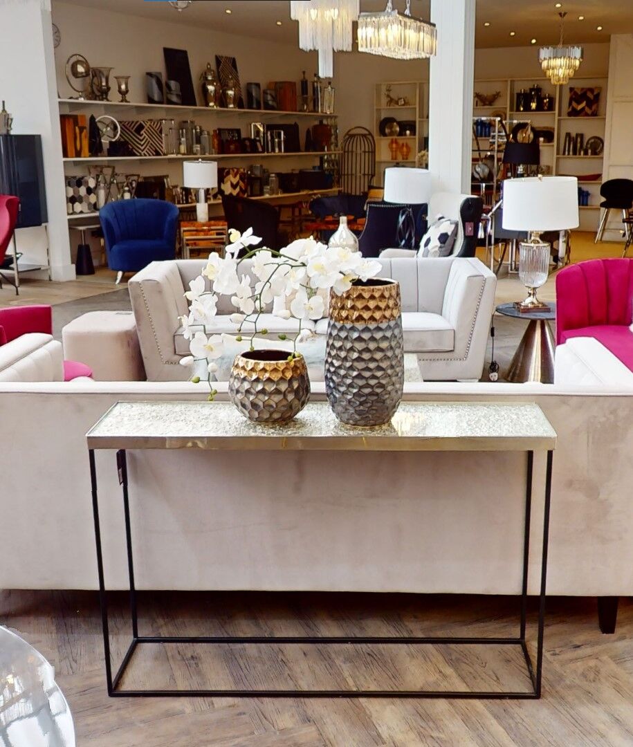Akola Silver Metal and Glass Console Table with Black Legs