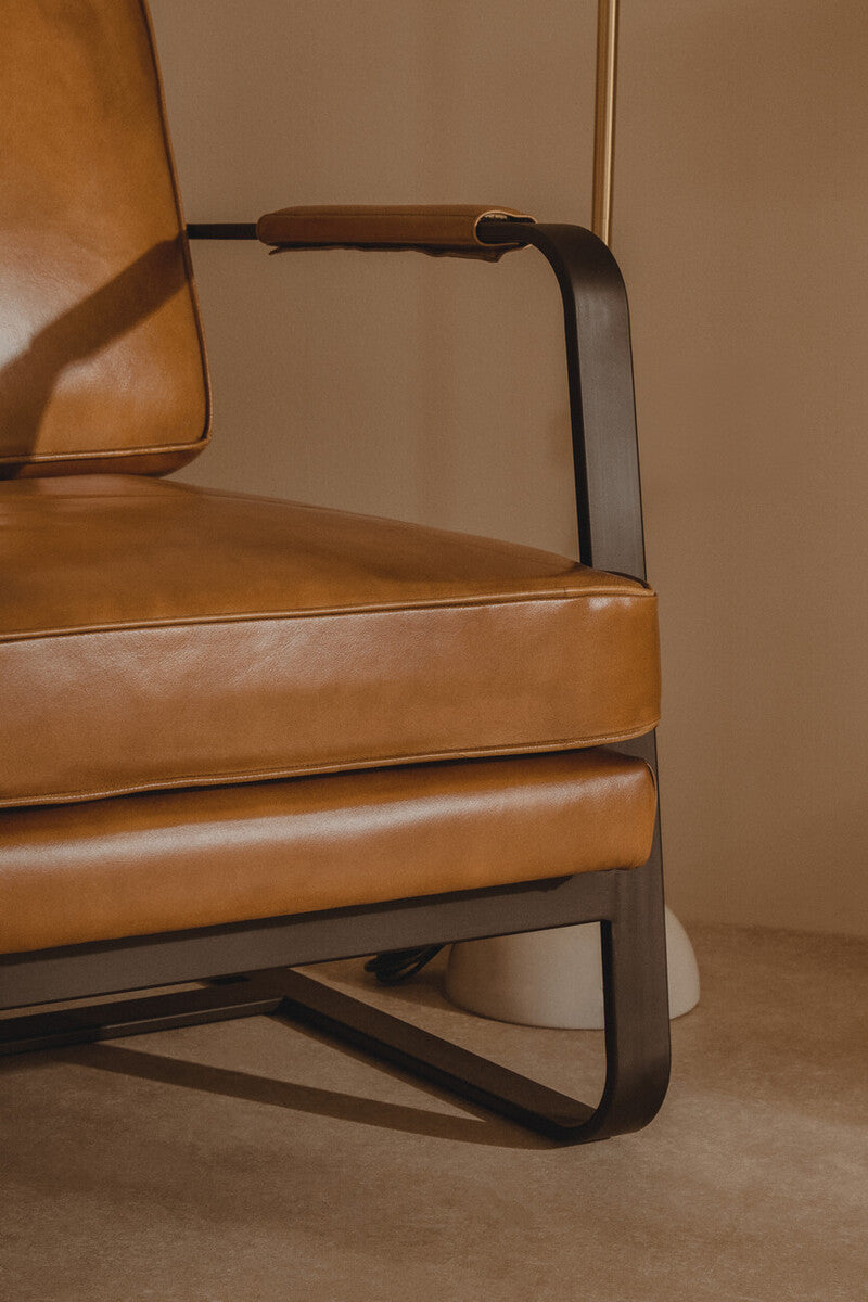 Buffalo Tan Leather Armchair with Curved Black Iron Frame