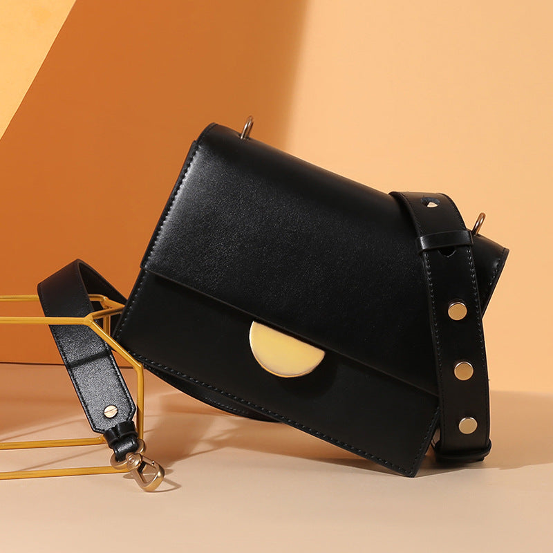 Crossbody bag with studded strap
