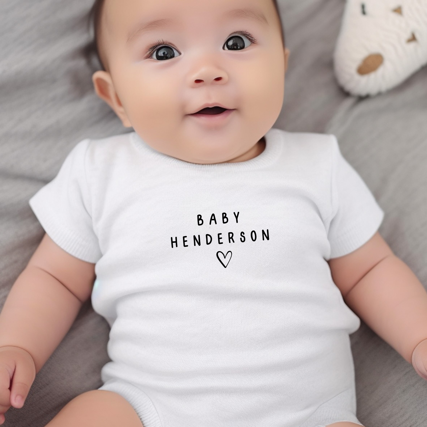 Personalised Black Surname Baby Grow, Vest or Bib with Name