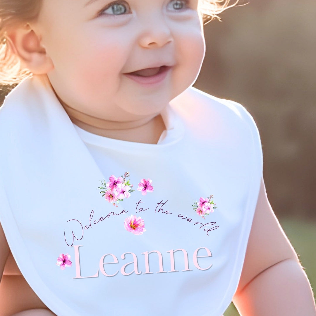 Personalised Pink Flowers Welcome to the World Baby Grow, Vest or Bib with Name