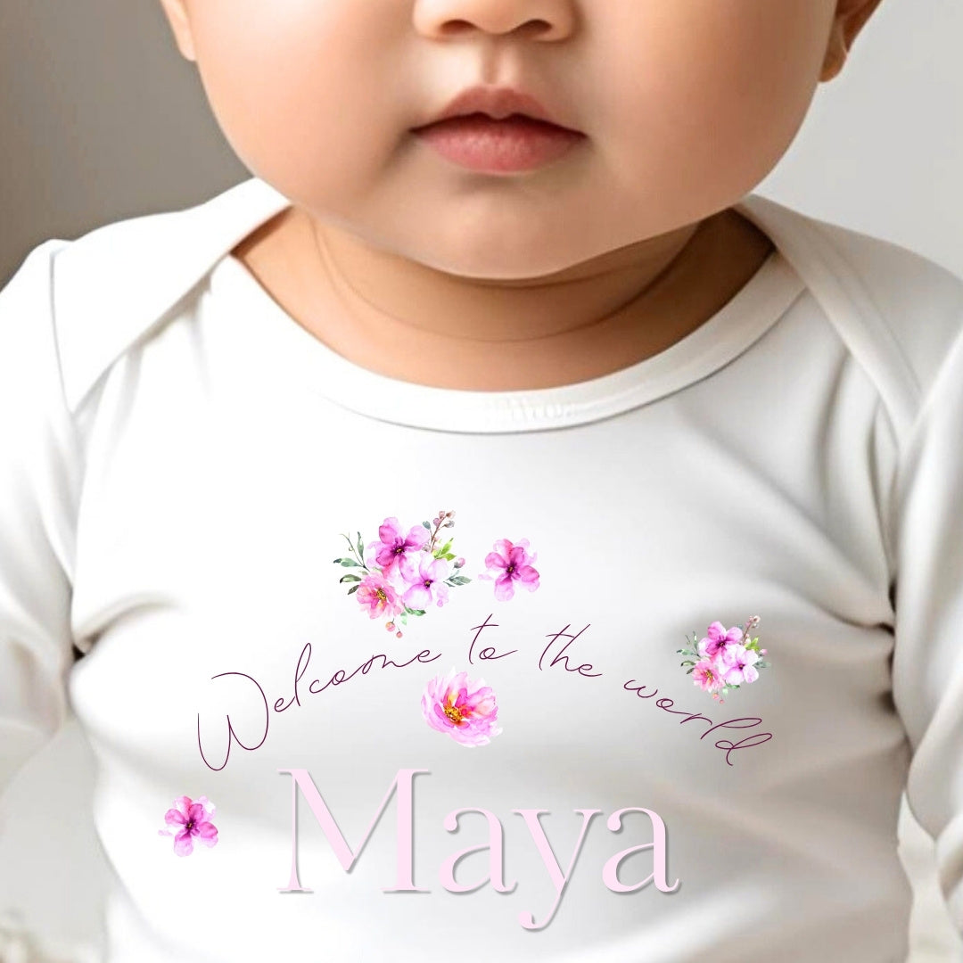 Personalised Pink Flowers Welcome to the World Baby Grow, Vest or Bib with Name