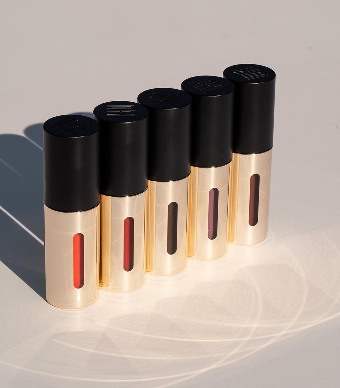 MAKE Beauty Serum Balm Intense: Hydrating Lip Gloss in Purple Paradigm
